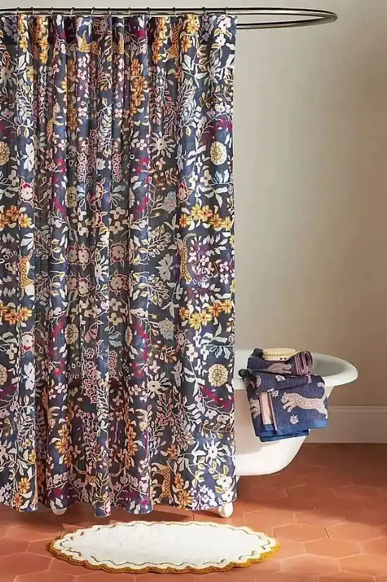 Shower curtains in modern home bathroom with neutral interior design